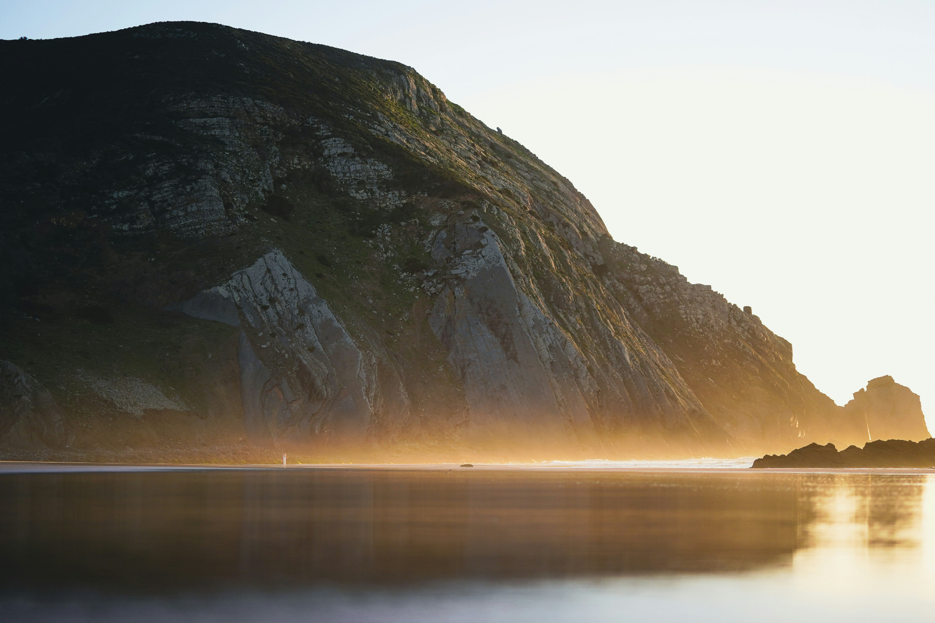 Castelejo beach with towering cliffs and golden light, Western Algarve